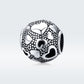 Round sterling silver charm bead with heart cutout pattern and black enamel accents