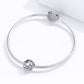 Silver snake chain bracelet with round heart-pattern bead charm and cat-shaped clasp