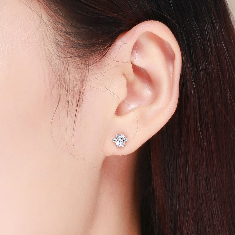 Sterling silver stud earring worn on the ear