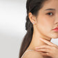 S925 sterling silver wing stud earrings on a model