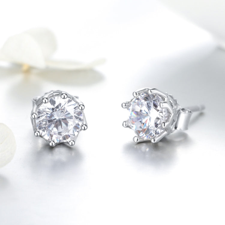 Sterling silver zircon stud earrings with round clear stone, side angle