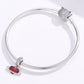 Sterling silver charm bracelet with red heart planet pendant