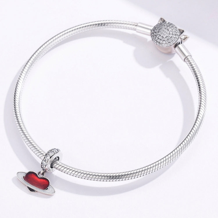 Sterling silver charm bracelet with red heart planet pendant