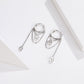 Pair of silver hoop zircon tassel earrings with dangling teardrop charms