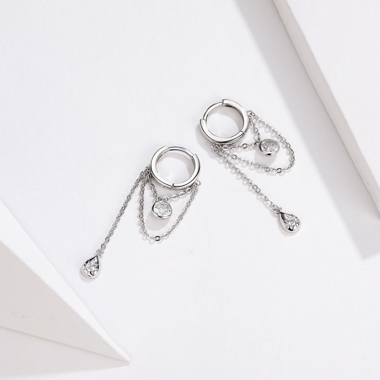 Two silver hoop zircon tassel earrings with round charm center and teardrop drops