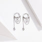 Silver hoop zircon tassel earrings with small round charm and teardrop dangles