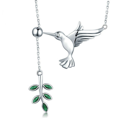 Sterling silver hummingbird necklace with green enamel flower pendant