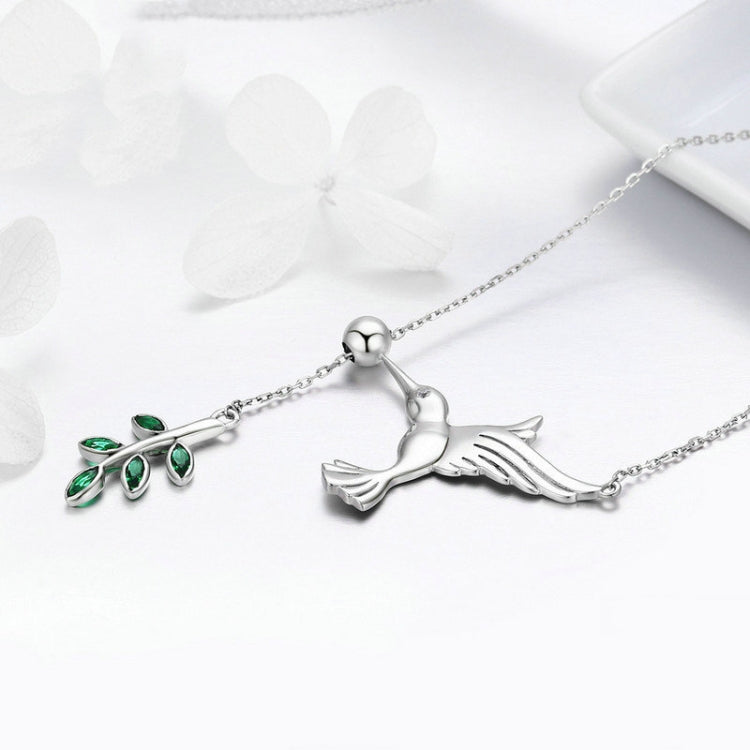 Sterling silver hummingbird necklace with green enamel leaf flower and CZ detail