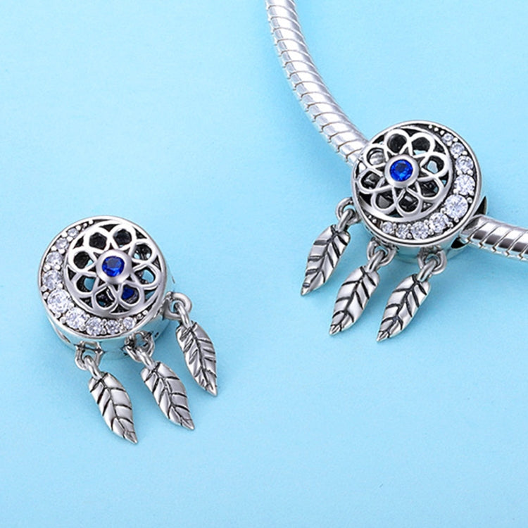 Set of dreamcatcher bead charms with blue centers and silver feather dangles