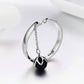 Oxidized silver open ring with black pearl charm on a chain, 925 band