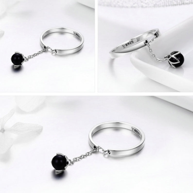 Sterling silver open ring with black pearl charm on chain, shown from multiple angles