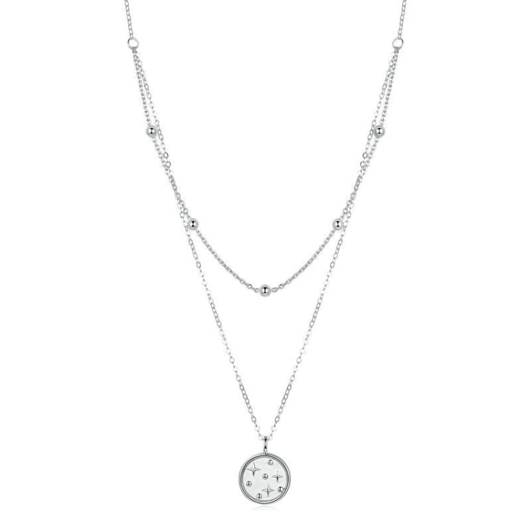 Double-layer silver necklace with small star pendant and round charm, fine chain links
