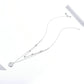Star and round charm double-layer silver necklace with delicate chain, small sparkle accents