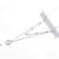 Small star pendant necklace with round charm on double strand silver-tone chain