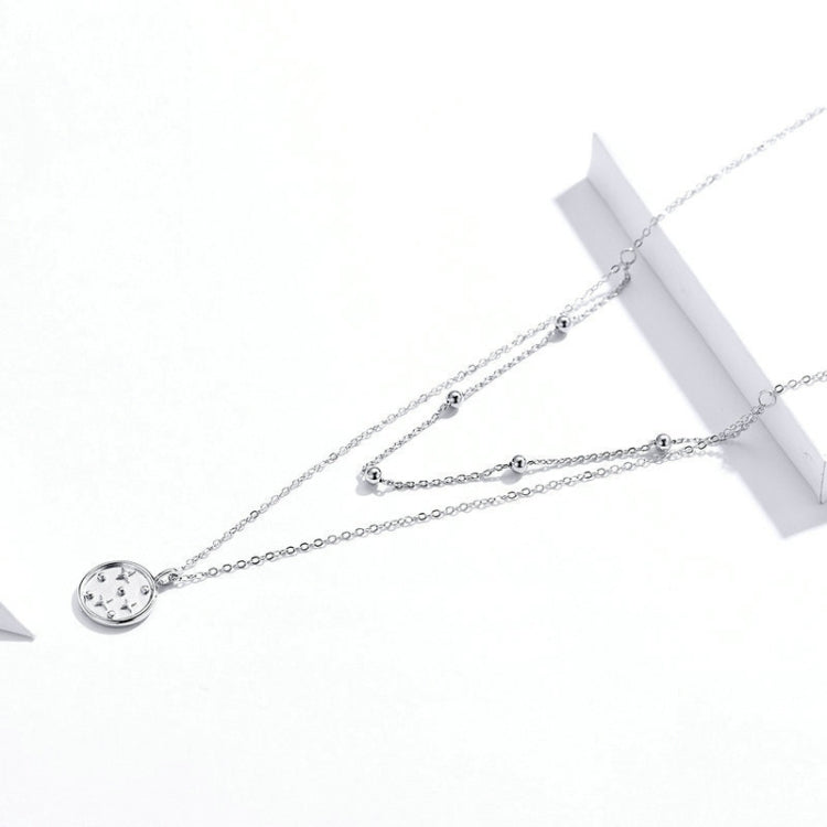 Small star pendant necklace with round charm on double strand silver-tone chain
