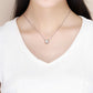 Sterling silver necklace with small schnauzer pendant charm centered on a thin chain