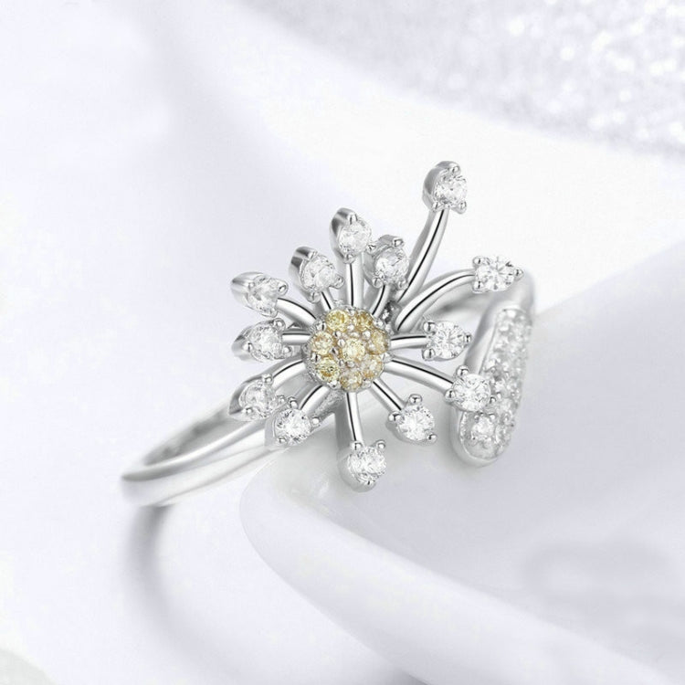 Close-up dandelion flower ring in silver with yellow center and clear CZ stones