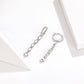 Sterling silver zircon drop earrings with linked square stones, pair
