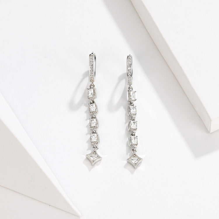 Silver-tone dangling earrings with vertical cz rows and a star-shaped bottom charm
