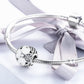 Sterling silver charm bracelet with flower bead and clear stone accents