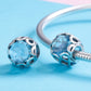 Sterling silver bracelet charm pair with blue faceted crystal beads
