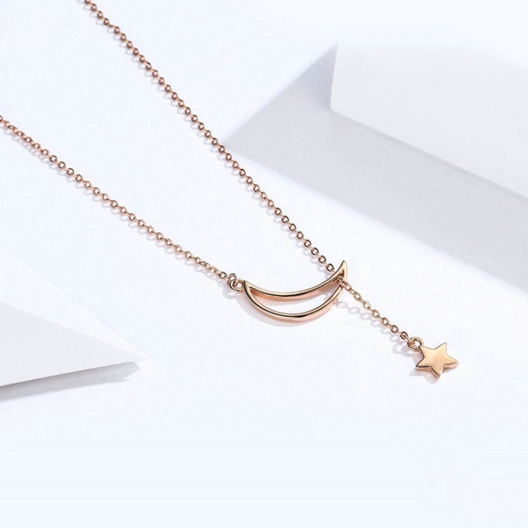 Rose-gold plated crescent charm necklace with hanging star pendant on chain