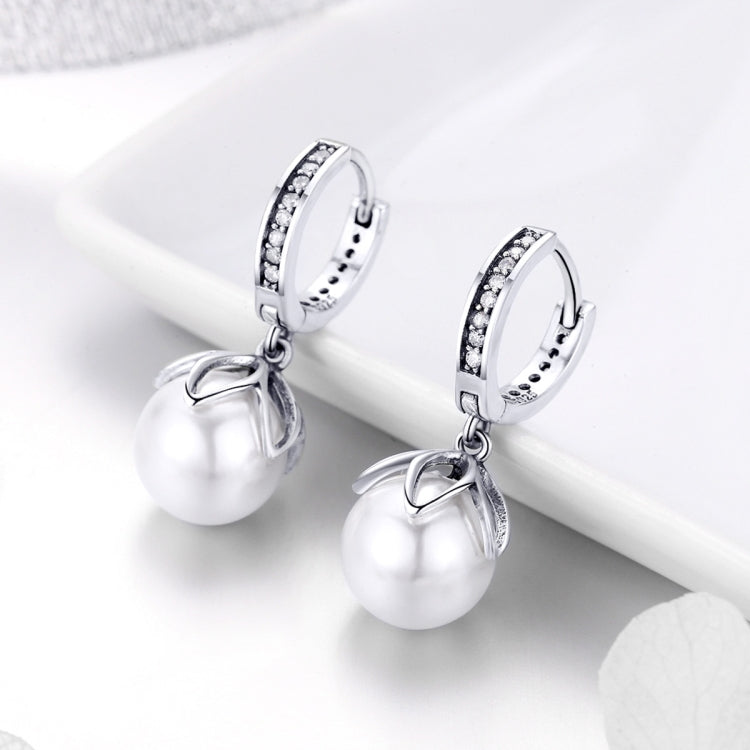 Small silver hoop earrings with CZ ring trim and pearl drop