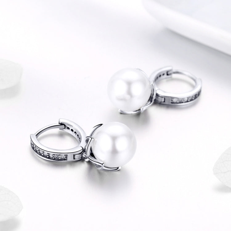 Round pearl drop earrings with hinged silver hoops and CZ detail