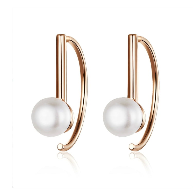 Rose gold hoop earrings with a white shell pearl bead