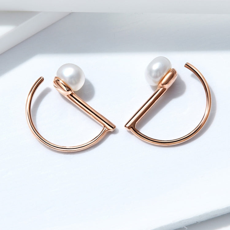 Rose gold hoop earrings with two white shell pearl bead ends