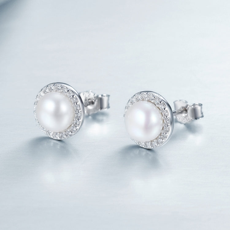 Pearl and diamond stud earrings in sterling silver