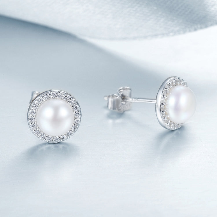 Sterling silver pearl stud earrings with crystal halo