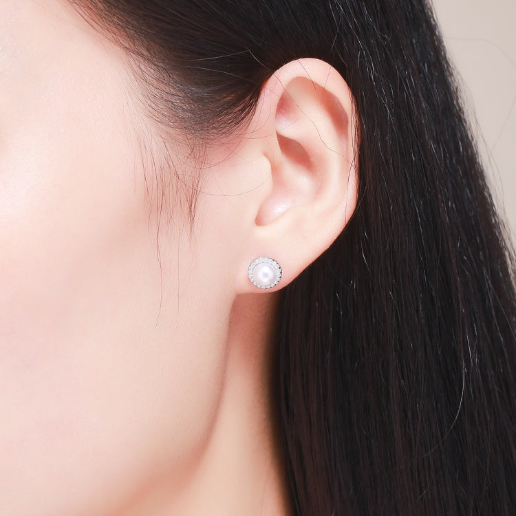 Pearl and diamond stud earrings in sterling silver
