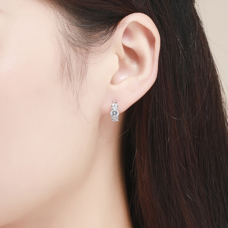 CZ hoop earrings on ear, small round stones on silver hinge