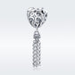 Heart-shaped sterling silver bead charm with heart motif and dangling chain tassel