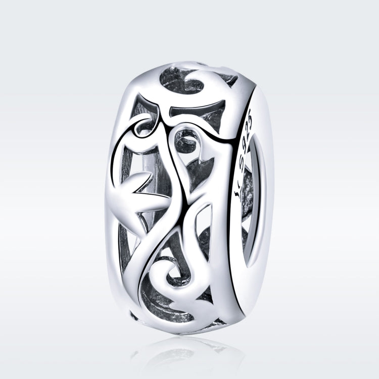 Close-up heart-shaped S925 silver charm bead with curly grass love pattern, high polish
