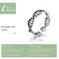 Open sterling silver DNA-style ring with ribbed bar details and bead-textured band