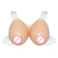 Silicone prosthetic breasts on mannequin bust with clear side straps, front view