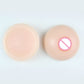 Round silicone breast inserts pair, textured front with areola nipple detail