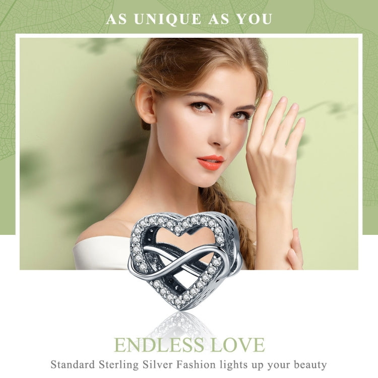 Sterling silver heart-shaped hollow diamond bead charm with infinity detail