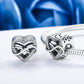Sterling silver heart-shaped hollow bead charms on a bracelet chain
