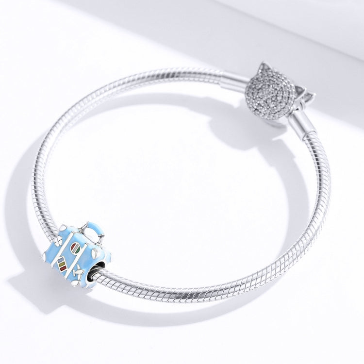 Silver charm bracelet with a blue suitcase bead and cat-shaped clasp charm