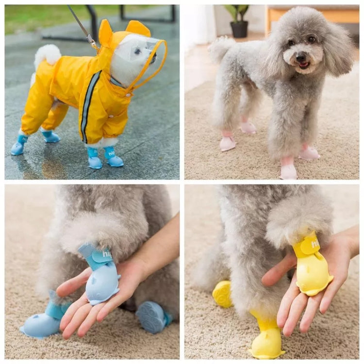 Set of 4 yellow silicone pet rain boots with cartoon paw soles and adjustable cuffs
