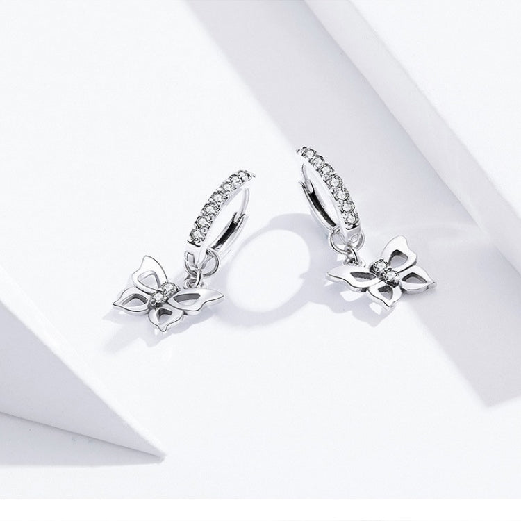 Sterling silver butterfly dangle earrings with hollow design and zircon accents