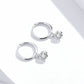 Silver hoop earrings with small round clear zircon dangle