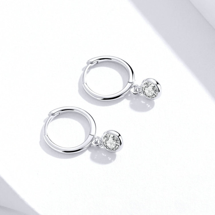 Silver hoop earrings with small round clear zircon dangle