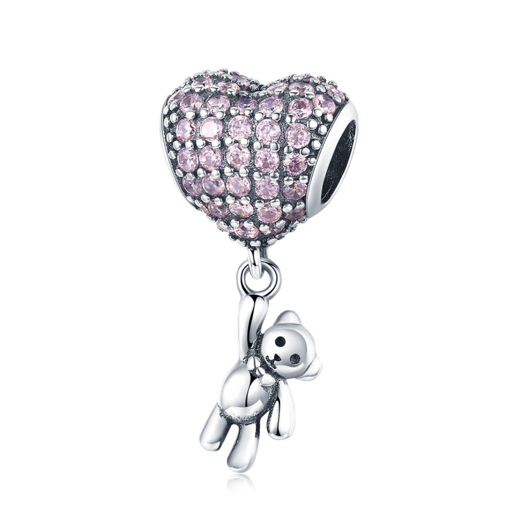 Heart-shaped sterling silver bead with pink zircon stones and dangling bear charm