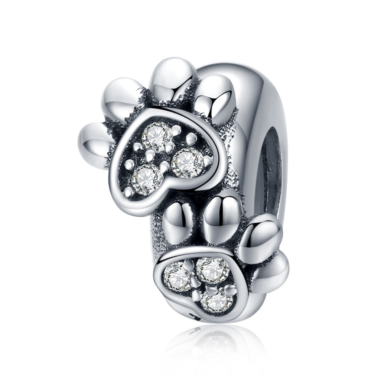 Sterling silver footprint charm bead with paw-print CZ stones and oxidized detailing