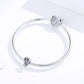Sterling silver snake bracelet with animal paw charms and CZ stone accents