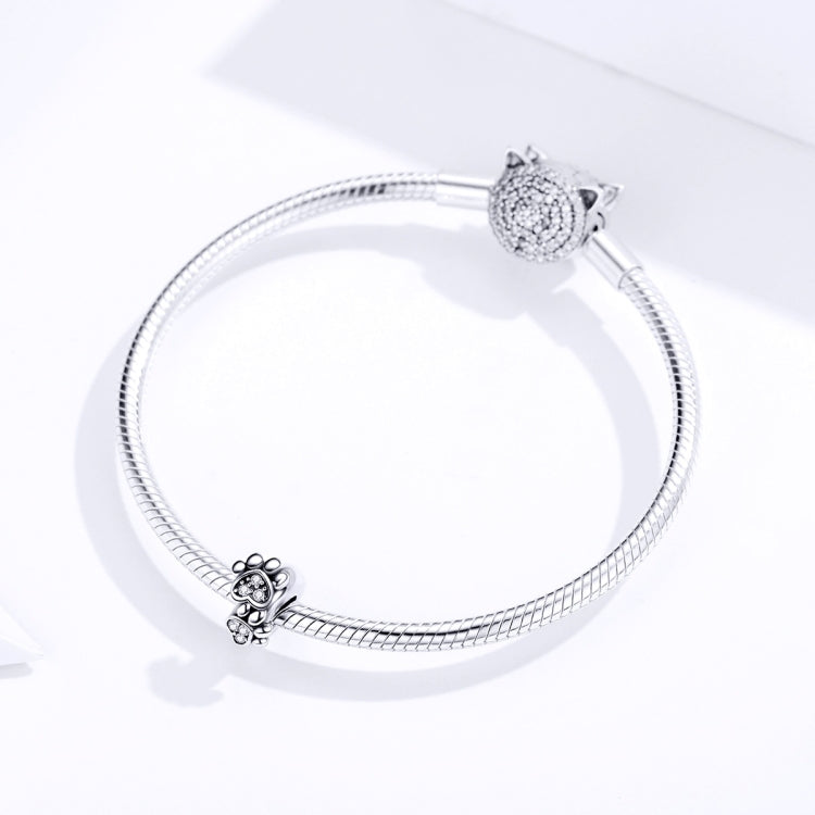 Sterling silver snake bracelet with animal paw charms and CZ stone accents